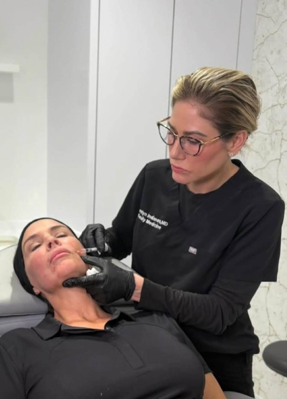 Dr. Carolyn Indianos, MD, at work in the Bespoke Aesthetics treatment room